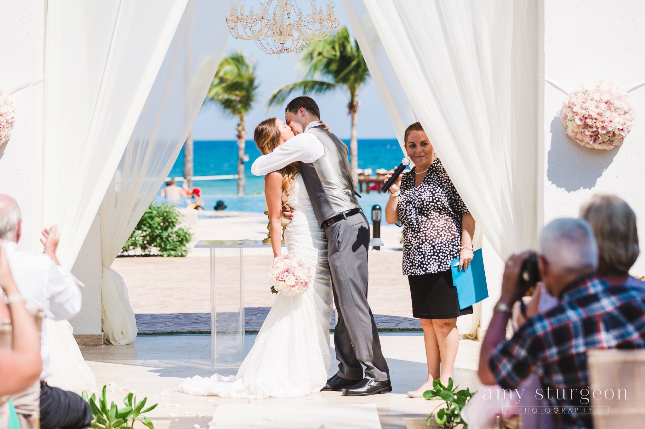 The first kiss at the Playa del carmen Mexico destination wedding